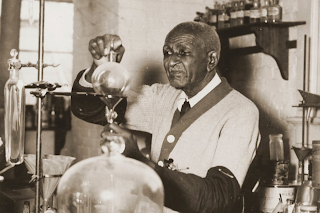 George Washington Carver working in his laboratory at Tuskegee Institute